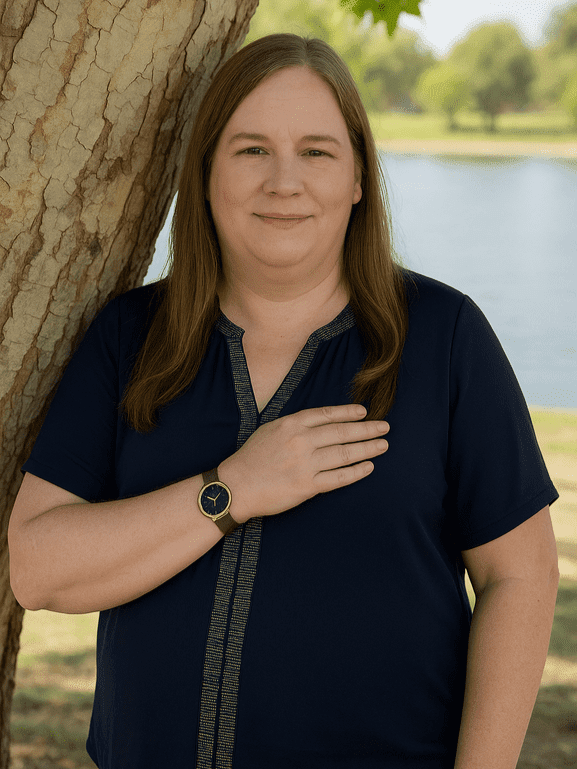 Sherry Edith Dansby standing beside a tree